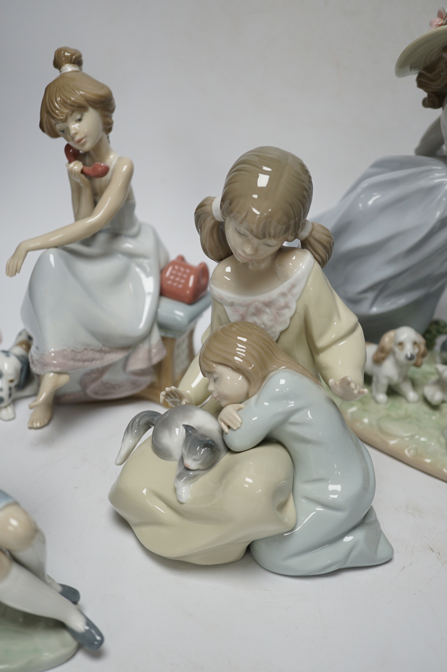 A large Lladro figure group “La gran familia, Puppy Brigade”, Baby Jesus, Duckling, New Friend, Chit-Chat, Sunday’s Child, Little Sister, Cat and Mouse and heavenly Tenor (9), largest 30 cm wide